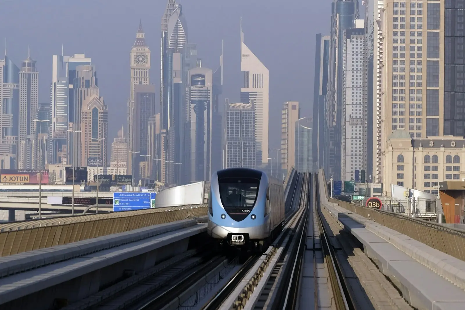 Dubai Metro train beside the towers of Sheikh Zayed Road