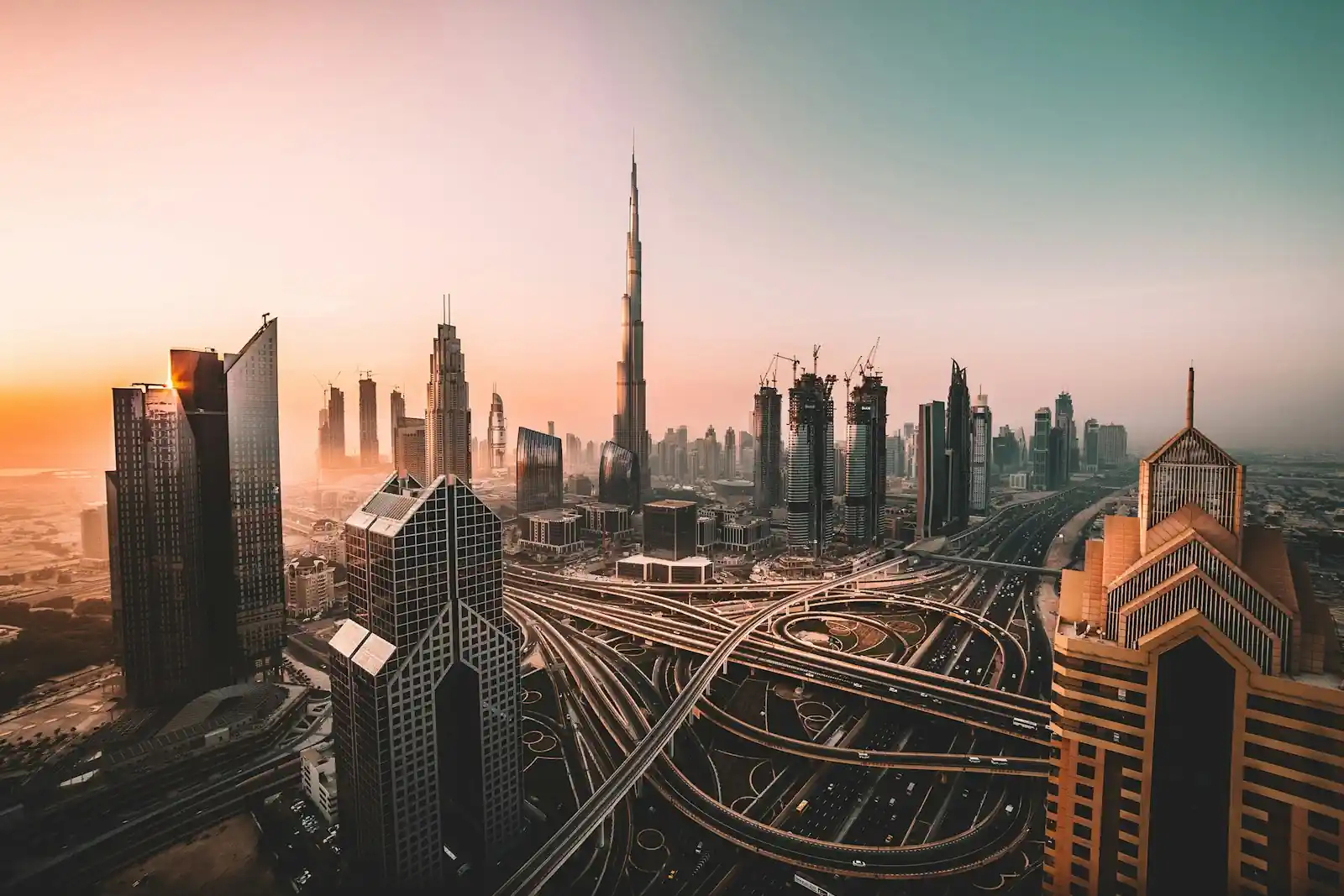 Burj Khalifa and Downtown Dubai towers above a highway interchange