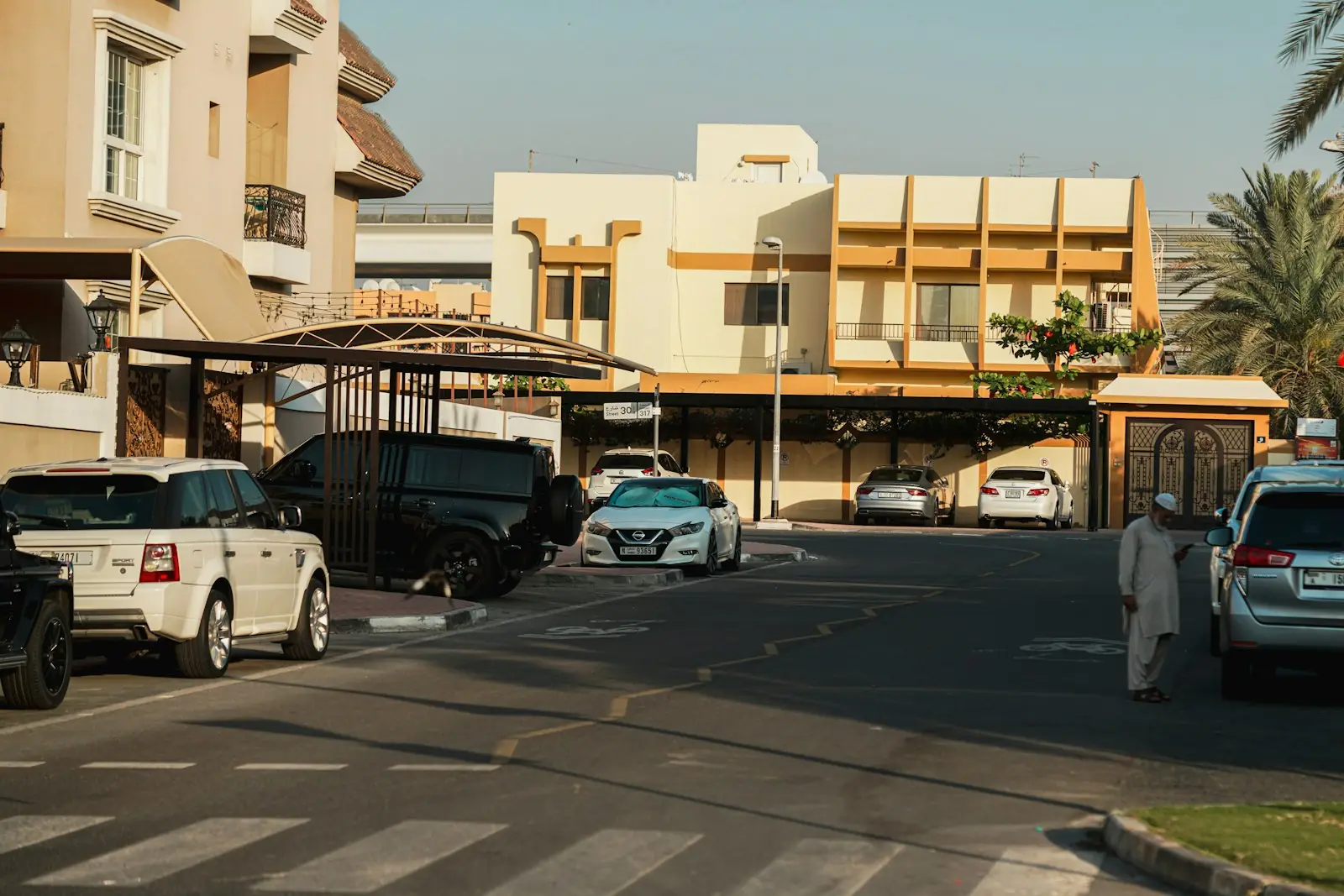 Low-rise villas and parked cars on a Dubai residential street